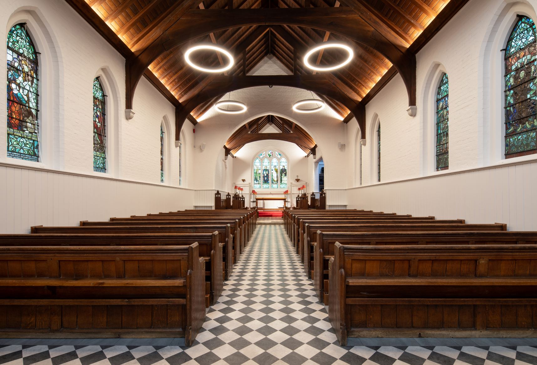 View looking down the nave of a chapel to the altar