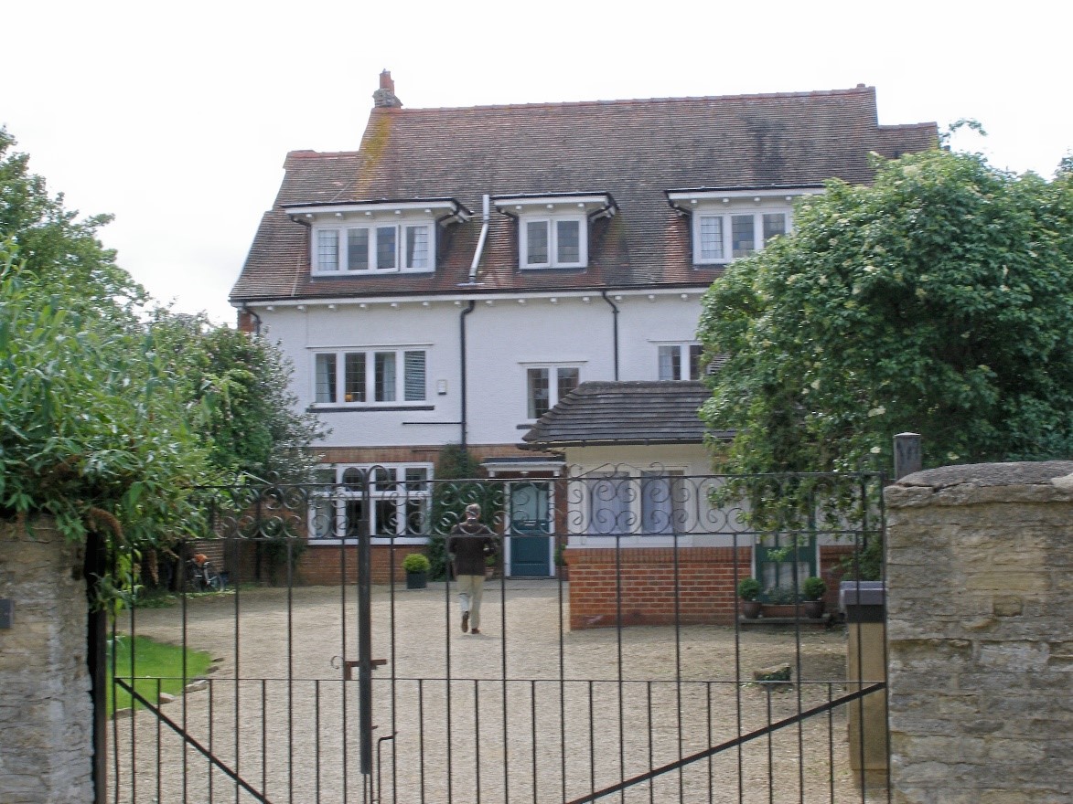 Photo of the front of Cottage Lodge at Summer Fields school. White three storey house.