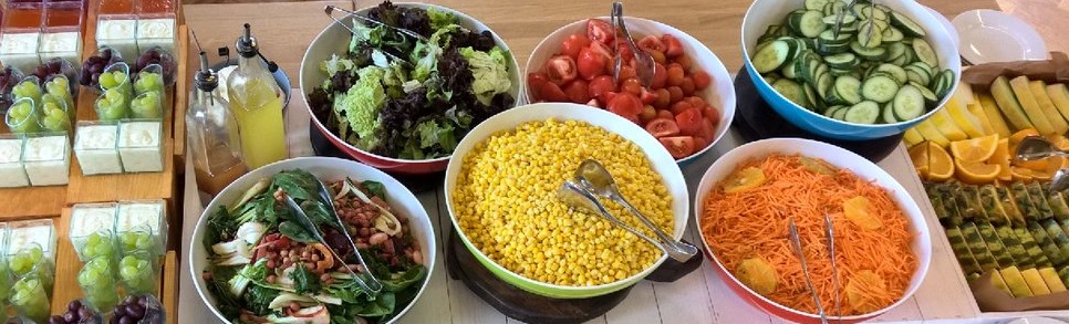 a selection of fresh salads and fruit