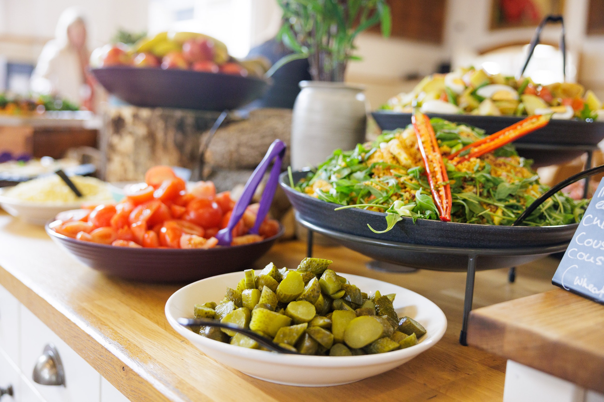 a selection of fresh salads and fruit