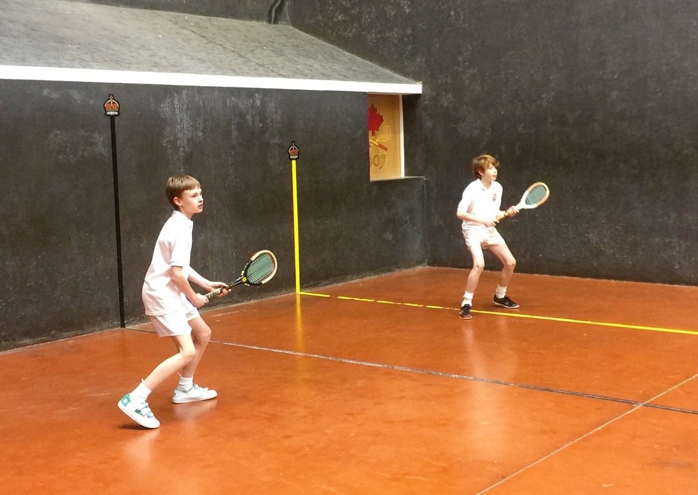 Boys enjoying Real Tennis at Radley