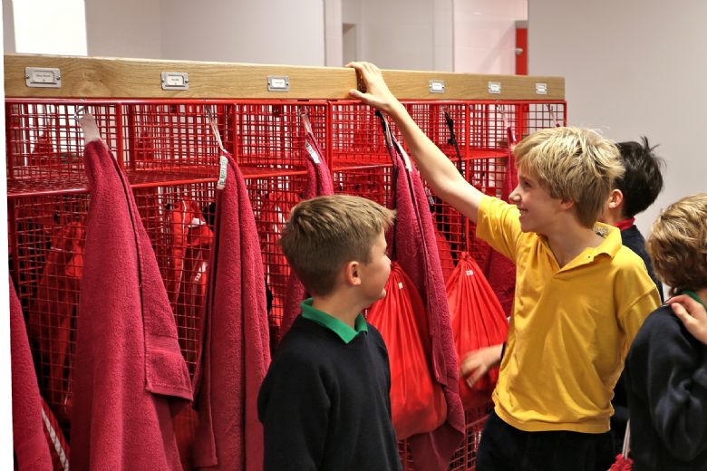 Group of young boys gathered in a cloakroom