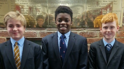 Three boys in ties and jackets